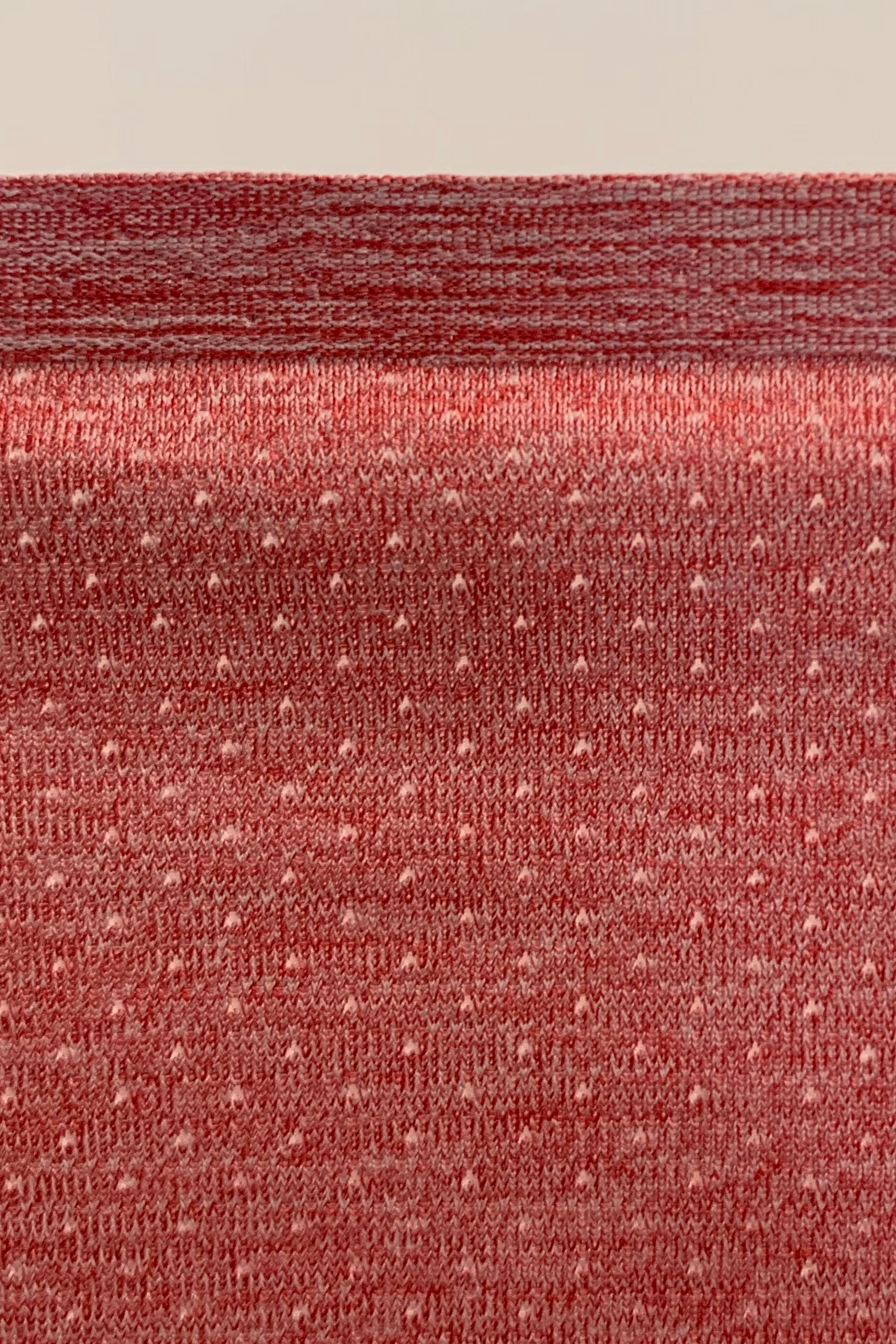 Men's Cool It Tank fabric. Red breathable fabric with perforated holes. Workout singlet.