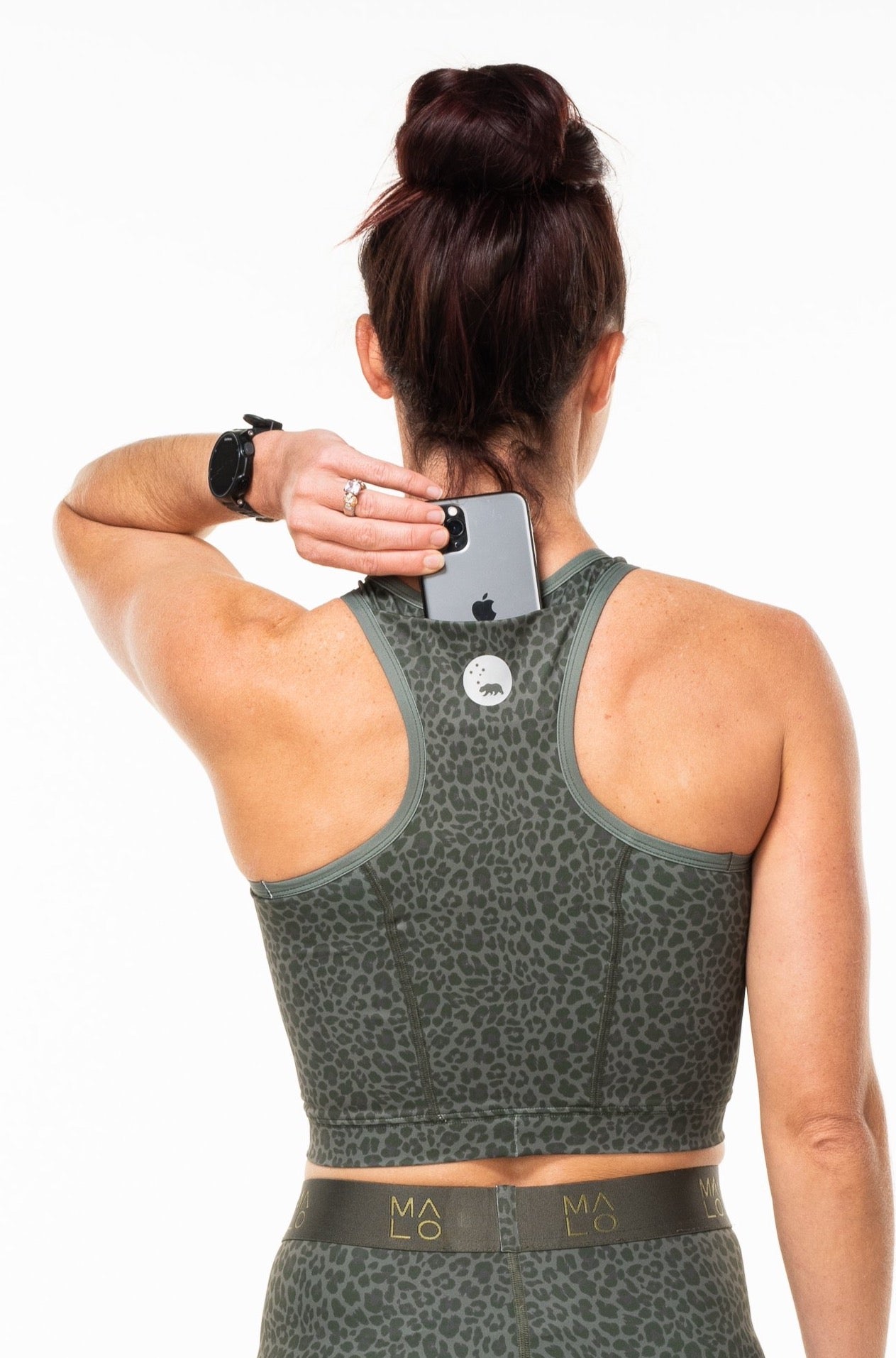 Back view of model wearing Panther Pedal Pumpers with matching core crop. Workout shorts and sports bra that match.