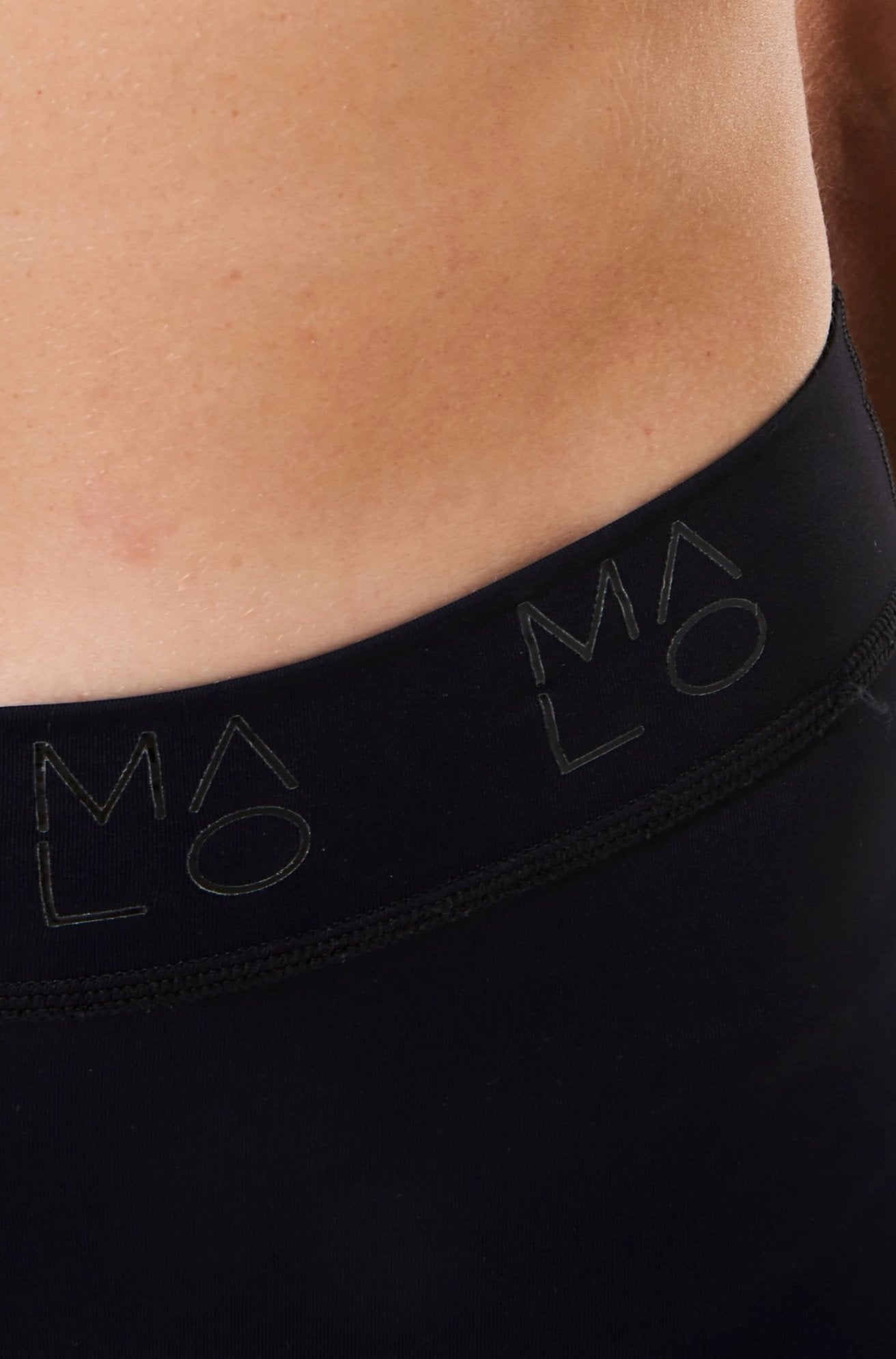 Close view of Pedal Pumpers waistband. 'MALO' logo wraps around.
