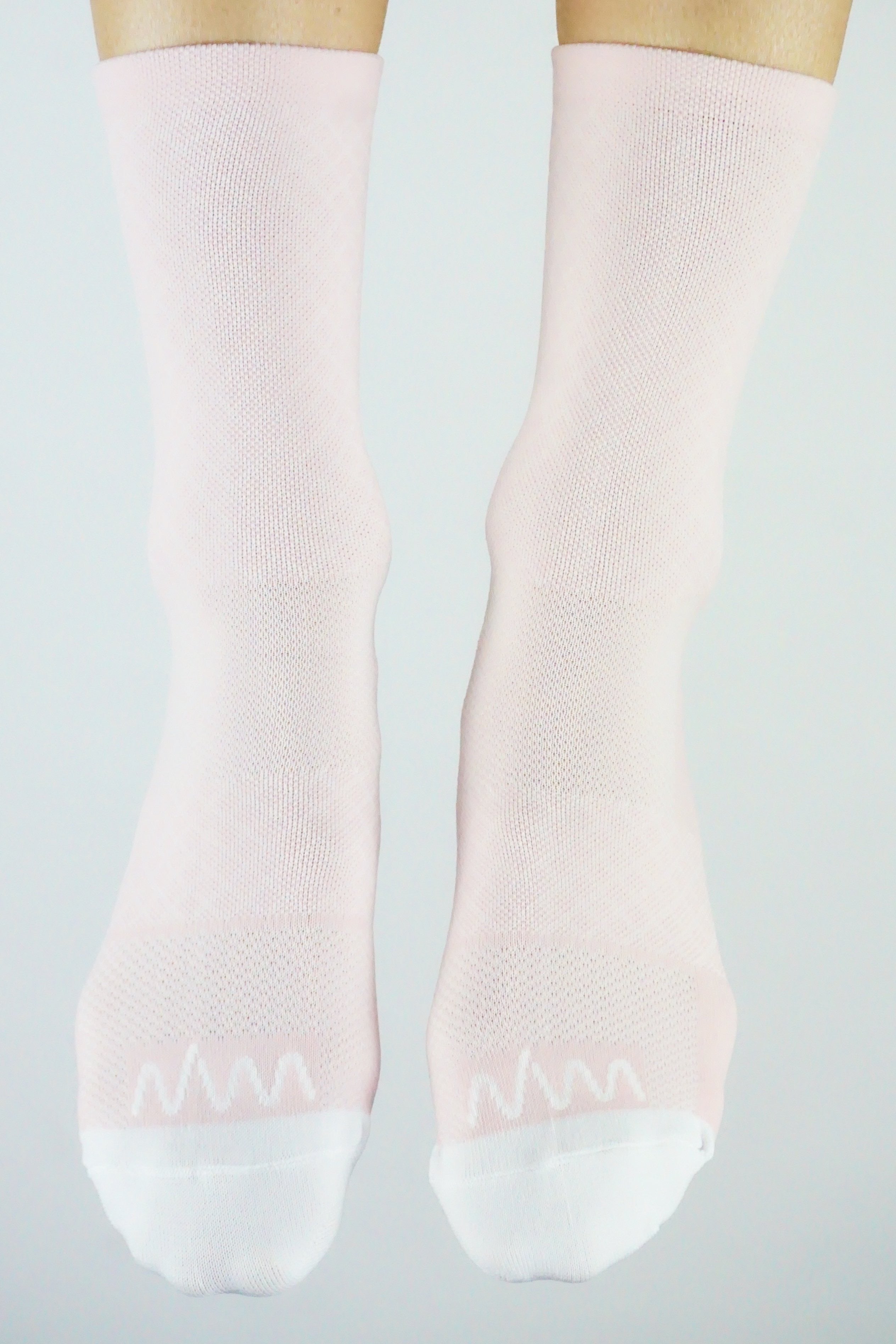 Front view WYN republic Carly Socks. Women's pink mid-calf running/cycling socks.