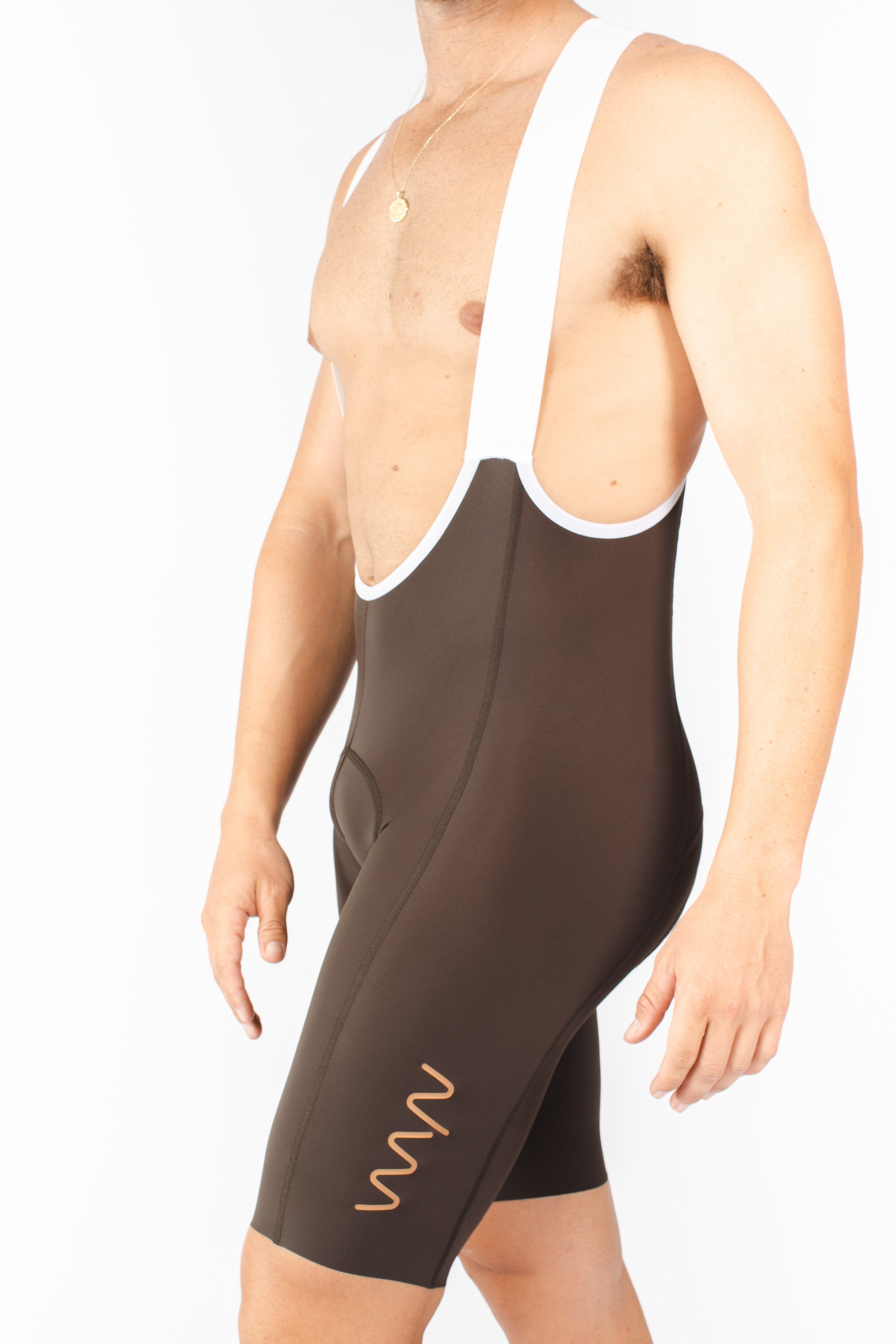 Men's Velocity 2.0 Cycling Bib Shorts. Brown bib shorts with tan WYN republic logo on thigh.