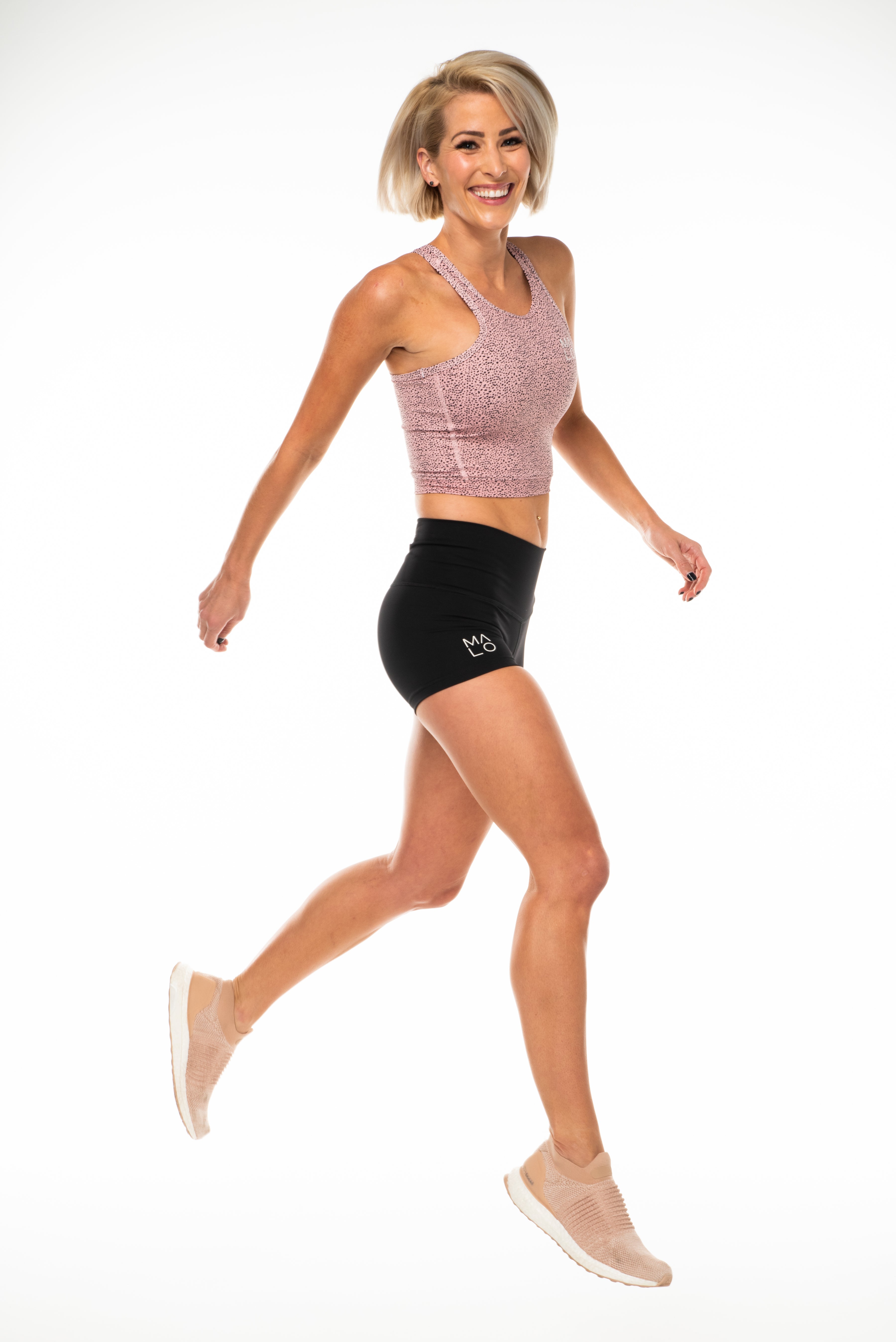 Model wearing Black PR Shorts. Women's black athleisure shorts.