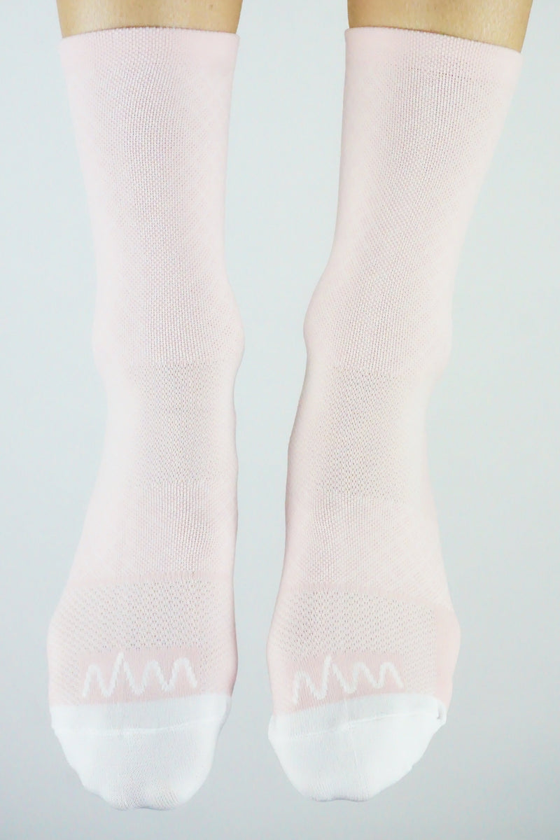 Front view WYN republic Carly Socks. Women's pink mid-calf running/cycling socks.