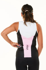 Model placing nutrition gel in back pocket of sleeveless tri top. Women's triathlon top with pockets.