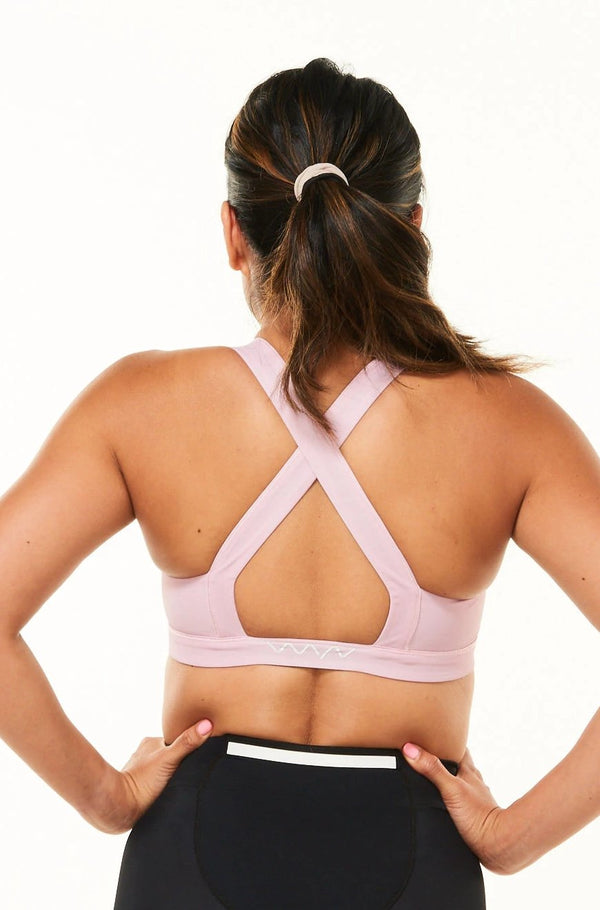 Back view of Do It Now Bra - Rose. Pink sports bra with cross-back straps for support.