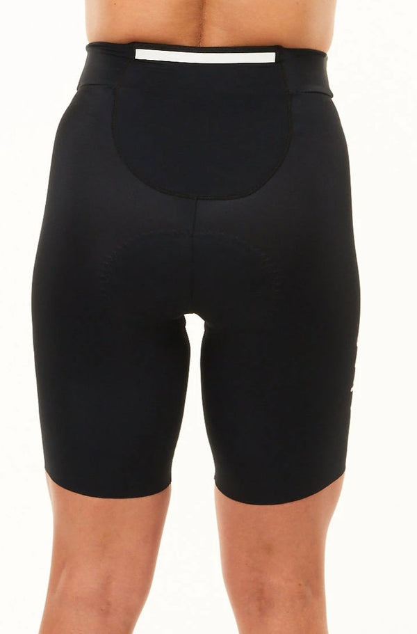 Back view women's Velocity Tri Shorts 7.5". Triathlon shorts with large pocket and reflective strip.