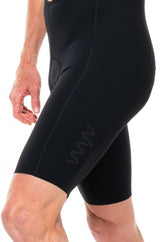 Left leg of men's Matte Black Velocity 2.0 Cycling Bib Shorts. Men's black cycling shorts with WYN logo on thigh.