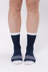 Front view women's Navy Captain Socks. Running & cycling socks with white logo and  dotted mid-foot.