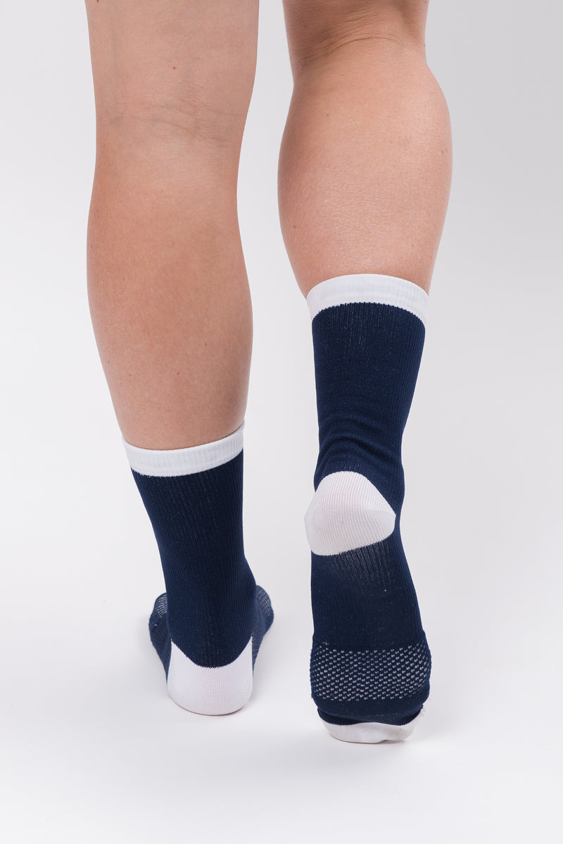 Back view women's WYN republic Captain Socks. Navy and white cycling and running socks.