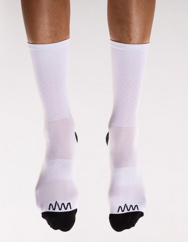 Front view White Flagship Socks. White mid-calf running/cycling socks with moisture-wicking fabric.