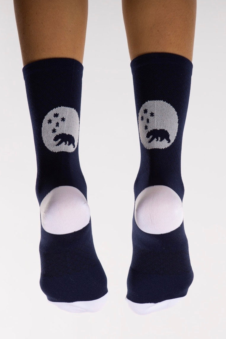 Back view WYN republic Navy Flagship Socks. Navy multi-sport socks with white bear logo.