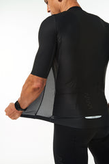 Back left angle of unzipped Onyx Hex Racer Jersey. Men's breathable cycling jersey with Italian fabric.