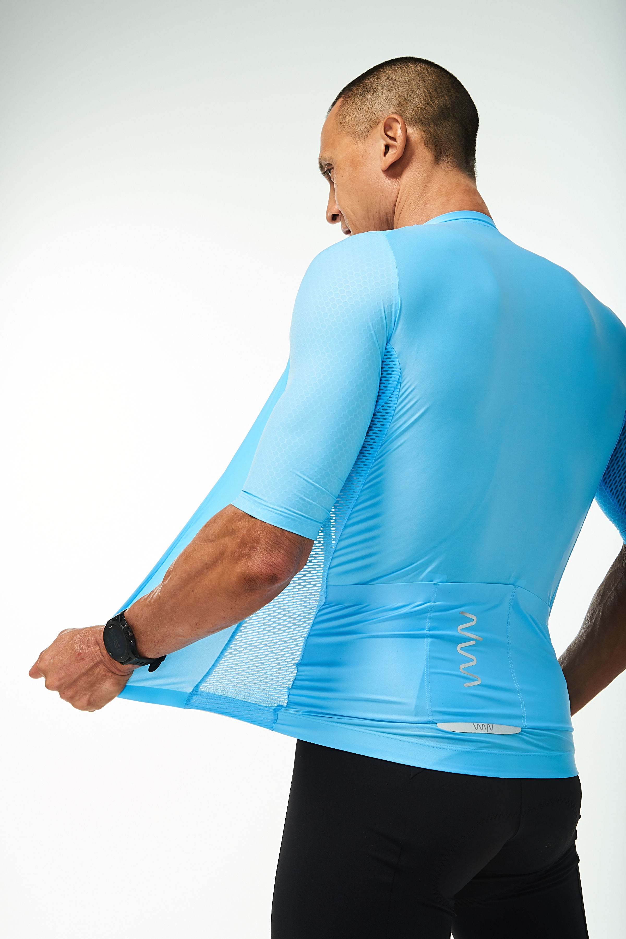 Back left angle of unzipped Sky Blue Hex Racer Jersey. Breathable Italian fabric.