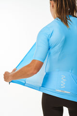 Back left angle of unzipped Sky Blue Hex Racer Jersey. Women's breathable cycling jersey with Italian fabric.