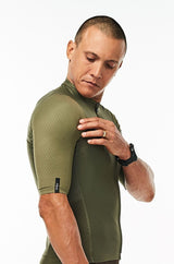 Right arm of men's Olive Hex Racer Jersey. Green aerodynamic sleeves with Italian Hex fabric.