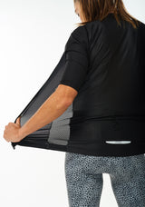 Back left angle of unzipped Onyx Hex Racer Jersey. Women's breathable cycling jersey with mesh panel and Italian fabric.
