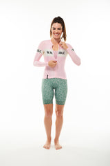 Model zipping Women's Carly Summer Long Sleeve Cycling Jersey. Cycling jersey with flip-lock zipper.